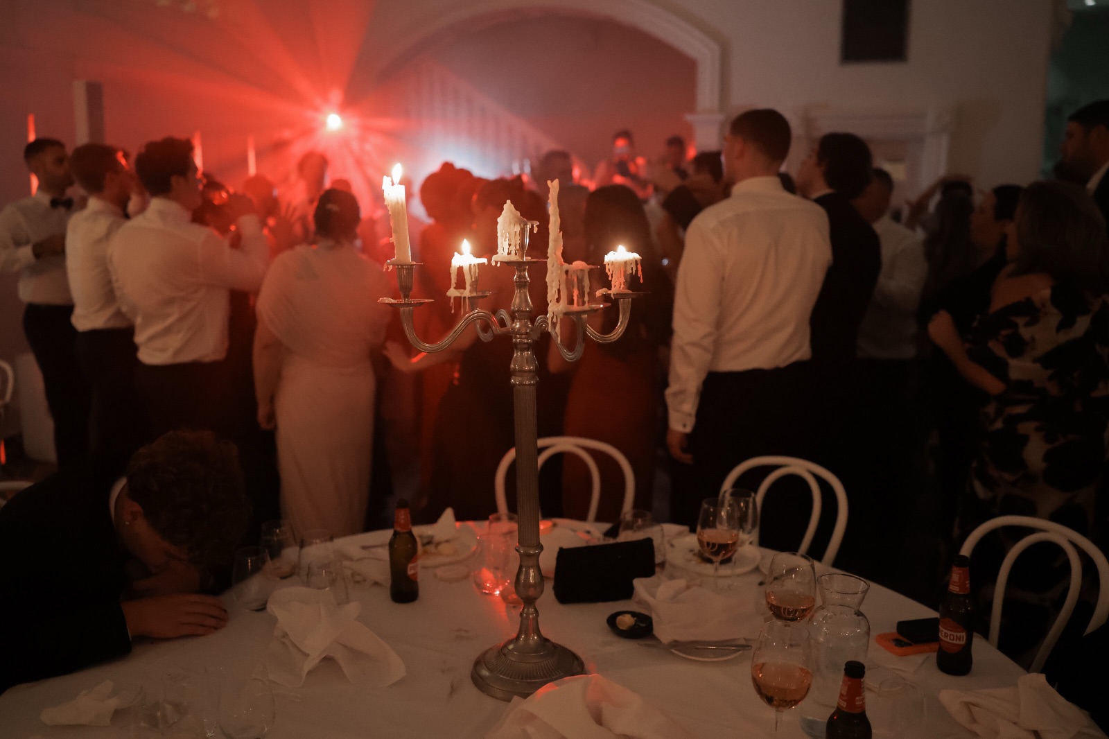 Wedding guests standing around the tables instead of dancing